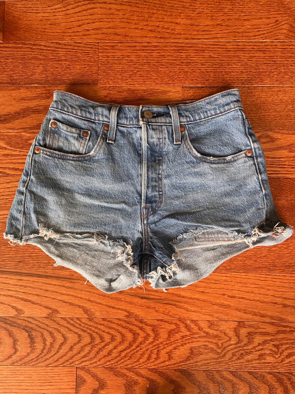 Levi's Light Wash Frayed Hem Cutoff Denim Shorts - women’s waist 25 - summer